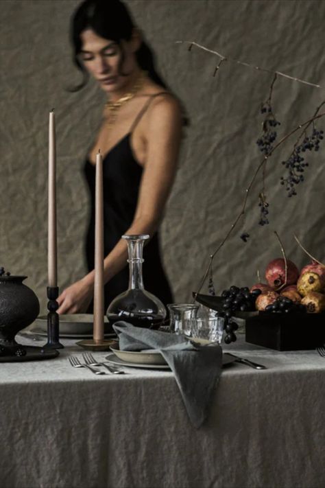 Ready to start planning your elegantly eerie night? Keep reading for some of our favorite chic Halloween décor, including black decorations and tabletop essentials that quite honestly stand up all year round. Dark Fall Tablescape, Moody Thanksgiving Table, Moody Feminine Aesthetic, Moody Thanksgiving Tablescape, Christmas Table Aesthetic, Moody Thanksgiving, Moody Tablescape, Moody Fashion, Dinner Party Tablescapes