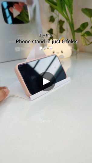 151K views · 29K reactions | Paper origami that's quick and useful 😉✨  Create a phone stand anywhere with just paper, that too in just 5 folds.  . . . . . . . . . . . .  #paperphonestand #paperorigami #origami #fypシ #fy #fyp #explore #quickart #quickcraft #craftideas #diyideas #viralphoneholder #phoneholder #viralphonestand #zeniart | Zeni Art ‧₊˚DIY with me ✂️༘⋆ | Megan Thee Stallion · Mamushi (feat. Yuki Chiba) Yuki Chiba, Thee Stallion, Paper Origami, Quick Crafts, Megan Thee Stallion, Chiba, Phone Stand, Phone Holder, Art Diy