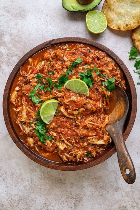 Chicken Tinga – shredded chicken in a smoky Chipotle tomato sauce. This Mexican recipe creates the most flavor-packed chicken that's perfect in tacos, quesadillas, enciladas, tostadas or over rice. A true crowdpleaser that the whole family will love! Healthy Chicken Tinga Recipe, Shredded Chicken Sauce, Best Chicken Tacos Recipe, Pulled Taco Chicken, Chicken Tostada Recipes, Shredded Chicken Quesadillas, Mexican Chicken Nachos, Recipes Using Shredded Chicken, Shredded Chipotle Chicken