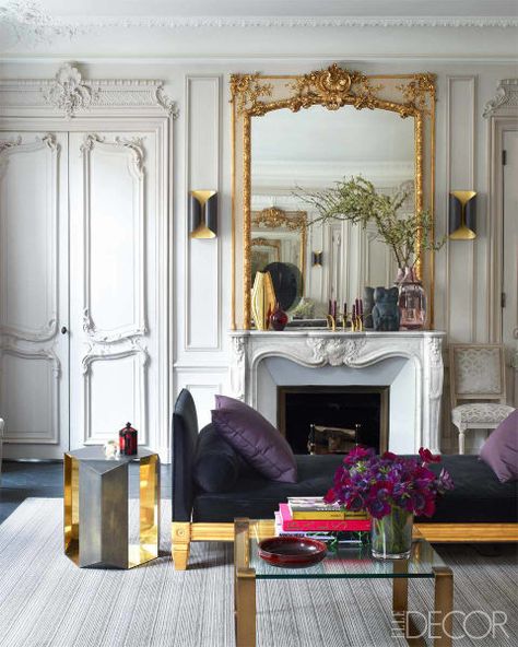 The living room in a 19th-century Parisian apartment screams glamour with its ornate detailing and gilded accents. The daybed is upholstered in a Lelievre velvet, the 1930s cocktail table was found at the Drouot auction house, and the gilt-wood mirror and marble fireplace are original to the apartment. See the rest of the apartment. - ELLEDecor.com Paris Living Room, Venice Apartment, Paris Living, Elle Decor Magazine, Paris Rooms, Apartment In Paris, Parisian Apartment, Paris Apartments, American Classic