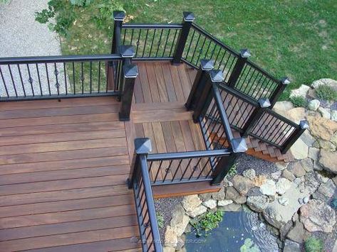 tigerwood-decking-007 Brown And Black Deck Ideas, Brown Deck Black Railing, Brown And Black Deck, Black And Wood Deck, Black Wood Porch, Black Stained Deck, Black Decking Ideas, Dark Brown Deck, Dark Wood Decking