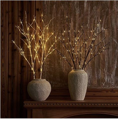 Cultivate a winter forest with lit branches that lend a magical glow to indoor and outdoor settings. Dotted with warm-white fairy lights, the branches look elegant on their own or trimmed with ornaments  #christmasdecor #lights #holidaydecor #whitelights #manteldecor #tabletopdecor #affiliate #amazonassociate Branch Lights, Artificial Tree Branches, Vase With Branches, Warm White Fairy Lights, Twig Lights, White Fairy Lights, White Branches, Fall Vignettes, Twig Branch