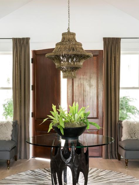 A pedestal table with sculptural base creates a beautiful focal point in the foyer, a formal entry that sets the tone for the home's fresh take on Southern style. Tall Dining Room, Diy Dream Home, Hgtv Dream Homes, Outdoor Kitchen Countertops, Entry Ideas, Outdoor Kitchen Appliances, Hgtv Dream Home, St Simons, Room Pictures