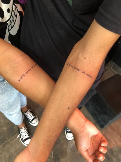 Never Be Alone Shawn Mendes tattoo |   matching couple tattoos xo Brother Sister Tattoo Aesthetic, Quote Matching Tattoos, Matching Phrases Tattoo, Unique Tattoos For Best Friends, Tattoos To Get For Your Brother, Bro Tattoo Ideas, Brother Tattoos For Sister, Tattoo For Sister And Brother, Tattoos For Brothers Sibling