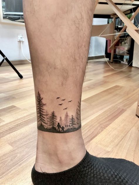 Forest Ankle Tattoo, Mountain Ankle Tattoo Wrap Around, Minimalist Forest Tattoo, Ankle Tattoo Men Ideas, Nature Arm Band Tattoo, Ankle Band Tattoo Mens, Mens Ankle Tattoos, Nature Band Tattoo, Arm Tattoo Band