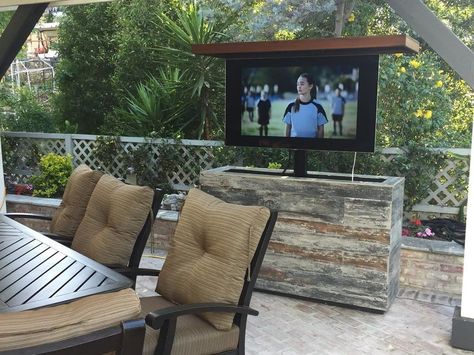 Outdoor TVs can be a welcome addition to anyone’s outdoor patio or living space. Watching that night game under the stars is a tough feeling to beat. Selecting the right TV though can be intimidating. What are the pros and cons of owning an outdoor TV? Can’t you just pop any old TV outside? What are things you should watch out for and more importantly what makes a great outdoor TV great? This outdoor TV buying guide is going to break all of that down for you and more. Outdoor Hidden Tv, Tv Outside, Outdoor Tvs, Outdoor Tv Cabinet, Island Cabinet, Traditional Patio, Tv Lift Cabinet, Tv Lift, Hidden Tv