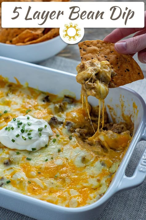 A recipe for a 5 Layer Bean Dip is great to have on hand for potlucks and get-togethers. It's easy and tasty and everyone will love it. 5 Layer Bean Dip, Bean Dip Appetizer, 5 Layer Dip, Layered Bean Dip Recipe, Layer Bean Dip, Layered Dip Recipes, Layered Bean Dip, Bean Dip Recipes, Bean Snacks