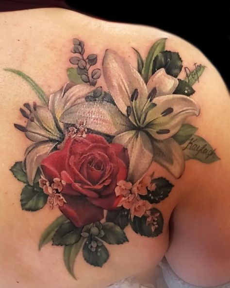 @katarina.heinze tattooed a bride's beautiful wedding bouquet. This realistically coloured tattoo displays the rose, lilies, and leaves with meticulous details. Tattoo Rework, Tattoo Coverup Ideas, Tattoos Sayings, Rose Tattoo Placement, Coverup Ideas, Rose Tattoo On Back, Realistic Flower Tattoo, Secret Tattoos, Flower Shoulder Tattoo