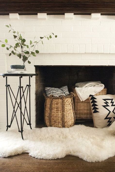 Frameless Candles In Fireplace, Faux Fur Rug In Front Of Fireplace, Baskets In Fireplace, Baskets In Front Of Fireplace, Faux Fur Living Room Decor, Decorate In Front Of Fireplace, How To Decorate A Non Working Fireplace, Decorate Non Working Fireplace, How To Style Fireplace