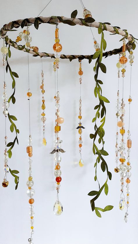 Our handmade one of a kind boho guardian angel mobiles are the perfect, one of a kind baby shower gift! Hand beaded using jewelry quality beads and crystals, each of our guardian angel mobiles has fairy garden vibes. Soothing angel shadows and ivy shadows are cast when hung near a nightlight. But during the day, color and sparkle are cast when the beautiful faceted glass beads and crystals catch the light! This listing is for 1 (one) large boho guardian angel mobile. Each is truly a one of a kin Fairy Core Decoration, Fairytale Decor Home, Boho Fairy Nursery, Fairy Mobile Diy, Ren Faire Decor, Fairy Garden Room Ideas Bedrooms, Fairy Core Shelves, Boho Room Diy, Crystal Mobile Diy