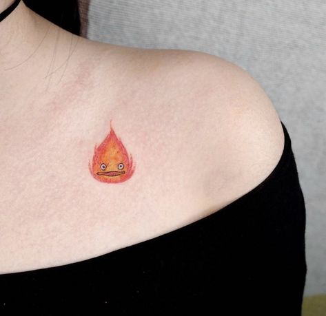 Howls Moving Castle Tattoo Calcifer, Howls Moving Castle Tattoo Ideas, Calcifer Tattoo, Howls Moving Castle Tattoo, Howl's Moving Castle Tattoo, Tatuaje Studio Ghibli, Studio Ghibli Tattoo, Castle Tattoo, Small Shoulder Tattoos