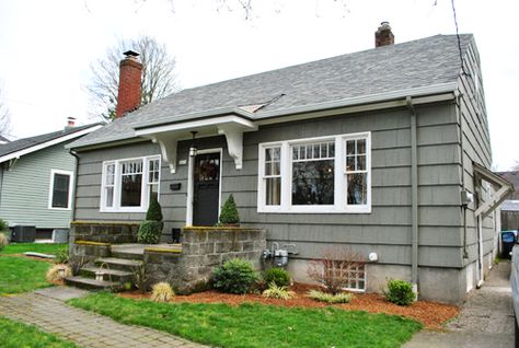 There is not a thing about this house that I don't love.  Totally my style inside and out. Portico Entry, Front Door Overhang, Front Door Awning, Door Overhang, Gray Brick, Gray House, Cute Little Houses, Young House, Young House Love