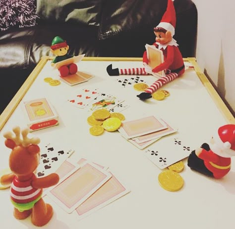 Elf on the Shelf. Card game. Gambling for chocolate coins. Elf On The Shelf Coin Ideas, Elf Playing Cards, Elf On The Shelf Chocolate Coin, Elf On The Shelf Playing Cards, Elf On The Shelf Playing Games, Elf On The Shelf Gold Coins, Elf 2023, Christmas For Kids, Elf Ideas Easy