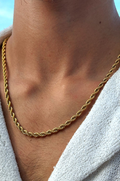 Picture showcasing a gold necklace for men in a twisted rope 2mm design. It's an exceptional piece of jewelry that catches the eye with its rich gold accent and unique structure. Specially designed for the modern man, it impeccably complements streetwear fashion, emanating an urban vibe that's impossible to ignore. Reflecting skillful craftsmanship, this necklace embodies the perfect fusion of traditional aesthetics and contemporary style. Gold Accessories For Men, Men’s Gold Necklace, Debs Suits, Necklace Design For Men, Mens Accessories Rings, Mens Gold Necklace, Men Gold Chain, Gold Necklace Men, Men's Necklace Gold