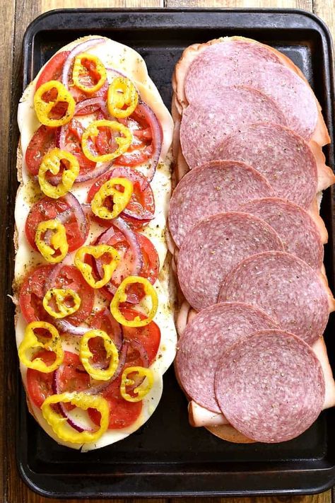 This Baked Italian Party Sub is perfect for feeding a crowd! Loaded with the delicious flavors of salami, turkey, ham, provolone, tomatoes, peppers, red onions, and homemade Italian vinaigrette, this sandwich is party-ready whenever you are....and guaranteed to make all your guests very happy! Italian Loaf Sandwiches, Salami Turkey, Appetizers For Party Crowd Pleasers, Awesome Sandwiches, Italian Subs, Italian Vinaigrette, Party Crowd, Light Summer Meals, Sub Sandwich