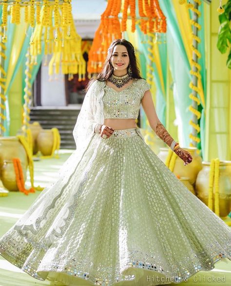 The Bridal Affair India® on Instagram: “It’s a happy Sunday when you spot the happiest twirl! Via @ritikahairstylist Make Up: @dollyouup_bys Flowers : @floristaa Outfit :…” Pista Color Lehenga, Colourful Lehenga, Gorgeous Lehenga, Bride Lehenga, Silk Half Saree, Orange Lehenga, Mirror Work Lehenga, Bridal Lehenga Designs, Cotton Lehenga