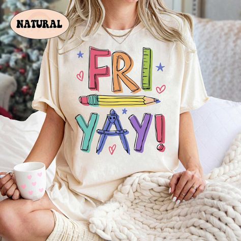 "Teacher Shirt, Happy Friyay Shirt, Funny Teacher Shirt, Fri-Yay Shirt, Teacher Team Shirt, Kindergarten Teacher, Teacher Appreciation Gift ↓ Click here to view our additional fashionable collections ↓ https://handcraftedbyhelenn.etsy.com Product Details: - 100% Cotton (fiber content may vary for different colors) - Medium fabric (5.3 oz/yd2 (180 g/m2)) - Classic fit - Tear away label - Runs true to size Care instructions: - Machine wash: warm (max 40C or 105F); - Non-chlorine: bleach as needed; Winter Teacher Shirts, Fun Teacher Outfits Elementary, Teacher Shirts Designs, Comfy Teacher Outfits, Fun Teacher Outfits, Kindergarten Teacher Outfits, Friyay Shirt, Teacher Fits, Teacher Accessories