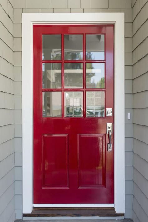 A very simple and contemporary front door with light gray siding and brushed nickel fixtures. The top half of the door is adorned by nine glass panels. Gray Siding, Front Door With Screen, Grey Siding, Red Front Door, Contemporary Front Doors, Front Door Entryway, Black Front Doors, Modern Front Door, Door Paint Colors