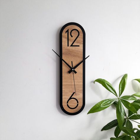 Minimalist Oval Wall Clock for Room Decoration. Material : 12 mm(about half inch) thick painted-veneered mdf wood (medium density board) Size : 17.5 x 4.8 inch | 43.5 x 12 cm Silent mechanism -  non-ticking quartz sweep movement, which ensure a nearly silent environment for your sleeping and working in any time. Avoid the annoying ticking noise. Easy to hang : With 1 nail you can hang it,powered by 1AA battery (not included) Customer service -  If you have any question with our items or service, Wood Items Home Decor, Hanging Wall Clock, Cool Clocks Creative, Cool Clock Designs, Diy Clock Wood, Living Room Designs Minimalist, Mdf Wall Clock, Wood Clock Diy, Wall Decor Clocks