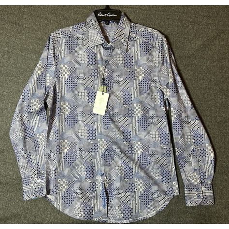 Ships Fast From A Reliable Seller! Check Out The Other Great Deals In My Store. Follow Me So You Won't Miss Out On Our Next Sale. Thank You For Stopping By. Elevate Your Wardrobe With This Designer Robert Graham Shirt That Exudes A Classic Fit With A Bohemian Twist. The Shirt Features A Geometric Pattern In A Colorful Palette, Long Sleeves With Contrasting Trim, And A Spread Collar With Button Closure. Perfect For Any Occasion, Whether It Be A Casual Day Out Or A Wedding, This Shirt Is Made From Robert Graham Shirts Men, India Dress, Men Closet, Robert Graham, Plaid Dress Shirt, Blue And White Style, Men's Button Down Shirt, Blue Camo, Tailored Shirts