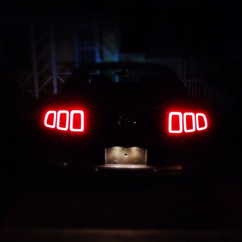 The rear tail lights of my 2013 Ford Mustang at night. Mustang Tail Lights, Mustang At Night, Mustang Night, 2013 Mustang Gt, Mustang Tattoo, Mustang Headlights, Bugatti Centodieci, Gtr Car, Ford Mustang Car