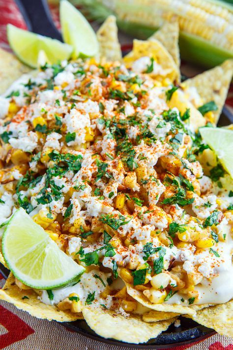 A recipe for Mexican Street Corn Nachos : All of the flavours of Mexican style street corn in nacho form with grilled or charred corn, mayo, feta, cilantro, cayenne and lime juice along with the nachos and a creamy melted Monterey Jack cheese sauce! Elote Nachos, Street Corn Nachos, Snacking Ideas, Corn Nachos, Mexican Party Food, Charred Corn, Authentic Mexican Recipes, Mexican Appetizers, Traditional Mexican Food