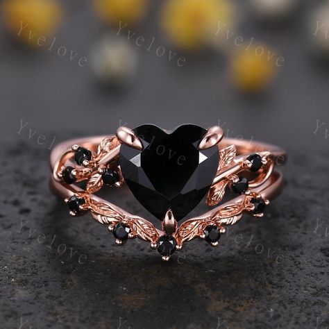 8 mm Heart Shape Black Onyx Ring,Vintage Twig Vine Leaf Ring,Antique Black Onyx Bridal Promise Ring Set Nature Inspired 14K Rose Gold band,Customized,Gift For Her,Christmas Ring gift,wedding gift Material:925 Sterling Silver,Black/Rose/White/Yellow Gold Plated             Solid gold (10k 14k 18k black gold, rose gold,yellow gold,white gold,Platinum available) Main stone:8mm heart cut natural black onyx stone Stones: Natural round cut Black spinel stone Band width:approx 1.5 Setting:prongs  set Matching band: Stone:with Natural round cut Black spinel stone Band width:approx 1.3 Setting:prongs set Our Service: All sizes available,please feel free to contact me if you need another ring sizes. Craft Period:Because all of rings are handmade to orders,it takes about 13-15 business days to make ( Rose Gold Black Ring, Onyx Promise Ring, Black And Gold Rings Women, Black And Pink Wedding Rings, Goth Wedding Ring Set, Halloween Wedding Rings, Black Heart Cut Jewelry For Wedding, Antique Black Jewelry For Wedding, Antique Black Wedding Jewelry