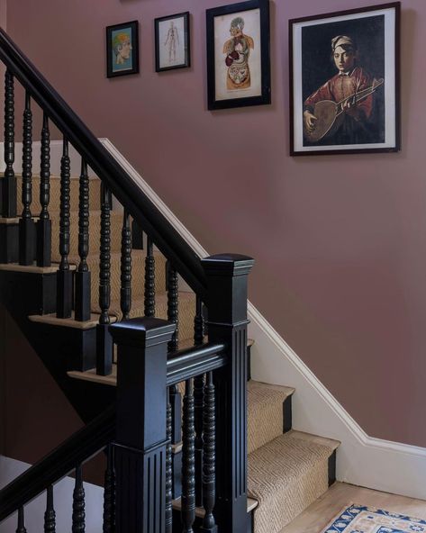 Moody and gorgeous in every light, the star of this space at our Chase Street Project is @farrowandball paint in Sulking Room Pink. Build: Design : @milkandhoneygroup Photo: @jessicadelaneyphotography #designer #design #gc #generalcontractor #newton #massachusetts #chasestreet #project #charming #staircase #victorian #milkandhoneygroup Pink Victorian Hallway, Victorian House Staircase, Sulking Room Pink Hallway, Lilac Hallway, 1930s Staircase, Monochrome Staircase, Colored Staircase, Moody Staircase, Victorian Staircase Ideas