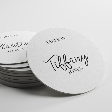 "A place card that is also useful as a coaster for your wedding guests. You will need to provide a spreadsheet with the proper information Column A = Table Number Column B = First Name Column C = Last Name WE DO NOT USE METALLIC INKS If you want a specific font please let us know to see if we have that one. Coasters are 4\" round Printed on heavyweight pulp board (2mm) To order just select your quantity and email your spreadsheet to natasha@corigraphics.com" Coaster Name Cards Wedding, Coaster Seating Chart, Coaster Place Cards Wedding, Wedding Name Place Ideas, Event Launch, Custom Coasters Wedding, Tiffany Jones, Wedding Coasters Favors, Place Cards Wedding