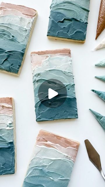 Madison Bagley on Instagram: "Let’s make my favorite cookie of this set! It also happens to be the easiest 😉 ‌ I love a palette knife! It’s one of my favorite tools to use on cookies and it’s the perfect smearing tool for this one! ‌ You may have noticed that the consistencies I used were all a little different. That’s bc I just used the icing I had left over when I had finished the other cookies🤷🏼‍♀️ ‌ Some may call it lazy to not remix to the same consistency but my # 1 motto in life is “work smarter not harder!” I also love the way it changed the smoothness and texture from layer to layer. ‌ ‌ #oceancookies #texturecookies #paletteknife #beachcookies #busybbakehouse #decoratedcookies #royalicingcookies #royalicing #sugarart #customcookies #sugarcookies" Motto In Life, Snow On The Beach, Beach Cookies, 70th Birthday Cake, Texture Tools, Cookie Videos, Beach Santa, Work Smarter Not Harder, Life Motto