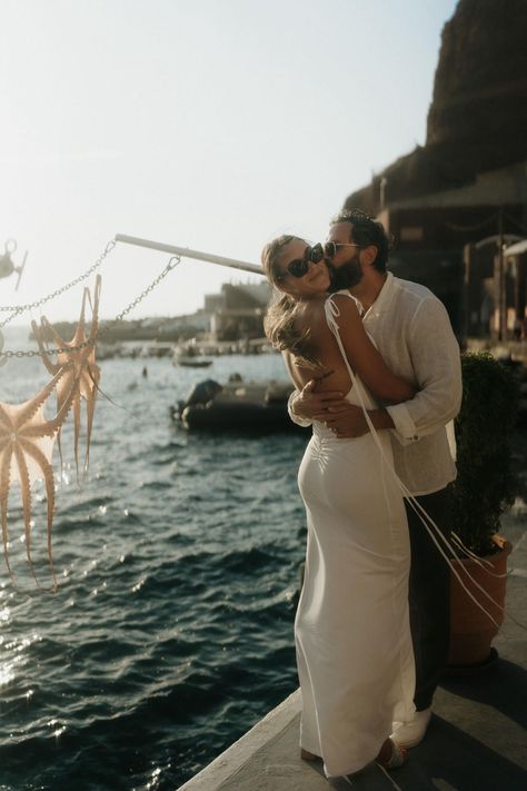 Santorini, Greece Luxury Wedding Photographer | International Destination Elopement Photography | Giulia and Nick were in Greece for their honeymoon. We decided to meet in the village of Oia to explore and capture some wedding portraits. We made our way down to Amoudi Bay and enjoyed a famous Oia sunset together. – Kassie Gunn Photography Santorini Wedding Aesthetic, Engagement Photos In Greece, Santorini Greece Elopement, Greece Photoshoot, Wedding Powerpoint, Couple In Santorini, Elopement In Santorini, Santorini Greece Couple Photography, Santorini Greece Wedding