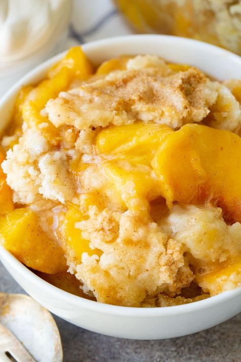 Fresh peaches are tossed with sugars and cinnamon with a stitch of thickener to bring together a delicious sauce on the peaches then topped off with a buttery cake mix! Easy Instant Pot Peach Cobbler with Cake Mix to the rescue! #peaches #cobbler #instantpot #pressurecooker #electricpressurecooker #dessert Cake Mix And Sprite, Peach Cobbler Recipe With Cake Mix, Peaches Cobbler, Cake Mix Peach Cobbler, Sprite Can, Peach Cobbler Cake, Cake Mix Cobbler, Cobbler Recipes Easy, Fresh Peach Cobbler