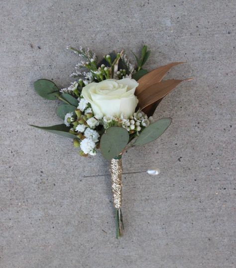 Groom Boutonniere: White spray rose, gold tinted Italian ruscus, eucalyptus, baby's breath, wax flower, white caspia, with glitter Champagne ribbon wrap //Celebration Flair Groom Boutonniere White, Boutineer Ideas, White Spray Rose, Champagne Wedding Flowers, Boutonniere White, Simple Wedding Bouquets, White Spray Roses, White Boutonniere, Italian Ruscus