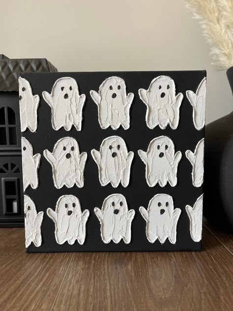 "This textured ghost painting is sure to add spirit and spookiness to your Halloween home decor! Would be perfect as a Halloween gift for a friend or coworker or for yourself!  Beautiful white textured ghosts on a black background.  Made with a mix of high quality acrylic paints and acrylic mediums for a beautiful 3D effect. Handmade with palette knives.  8 inch by 8 inch stretched gallery wrapped canvas and coated with UV resistant varnish for protection.  Would be beautiful in a small space or as shelf decor.  Each piece is unique and cannot be replicated, making this truly a \"one of a kind\" painting. *IMPORTANT: Colors and lighting may vary slightly in photographs. Colors and lighting of the original piece may also vary slightly depending on the natural lighting in the room.* ~Each ar Ghost Plaster Art, Ghost Texture Art, Easy Canvas Art Fall, Fall/halloween Decor Ideas, Fall Textured Painting, Diy Halloween Canvas, Ghost Acrylic Painting, Halloween Craft Night, Simple Fall Paintings