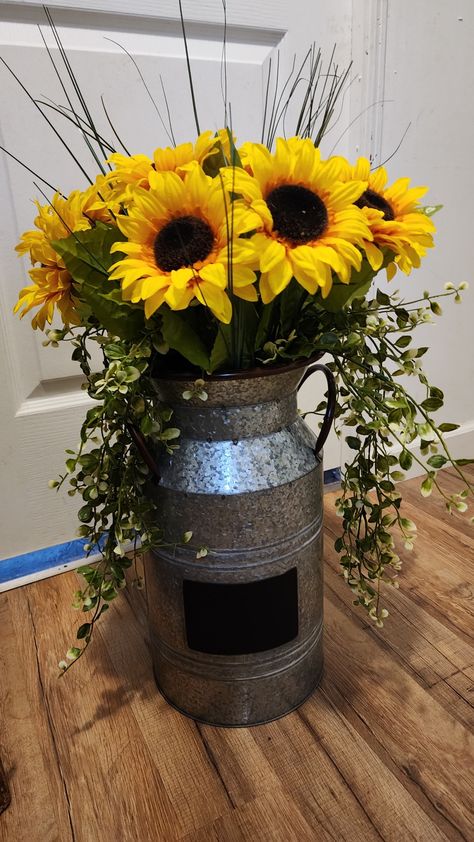 Rustic sunflower jug arrangement . Used for end of arbour or isle way Metal Milk Jug, Sunflower Arrangement, Sunflower Arrangements, Ranch Remodel, Sunflower Bouquets, Floral Arrangements Diy, Wedding 2024, Milk Cans, Milk Jug