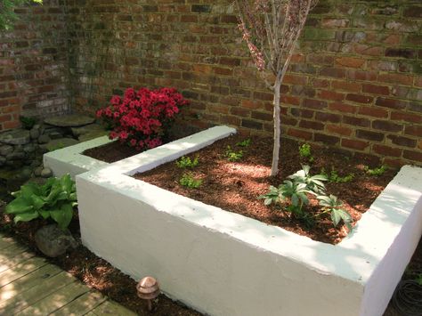 Stucco planter boxes provide a great contrast with the city's many brick walls.      'Like' Outdoor Dreams on Facebook for access to our complete portfolio and helpful articles on improving your landscape.      http://www.facebook.com/OutdoorDreams?sk=app_190322544333196 Diy Brick Planters Outdoor, Stucco Raised Garden Beds, Stucco Planter, Stucco Planters Retaining Walls, Planter Box Wall Brick, Cinderblock Planter Wall, Cement Brick Garden Bed, Backyard Refresh, Stucco Paint