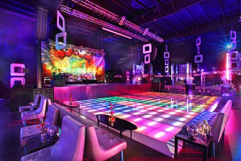 Guests danced on a colorful, light-up dance floor. Dance Party Decorations, Light Up Dance Floor, 70s Party Theme, Studio 54 Party, 70s Theme Party, 70's Party, Disco Decorations, 80's Party, Nightclub Design