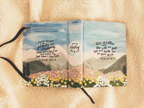 Custom Hand painted bible #bible #journaling #mountains #flowers Painted Bible Mountains, Painted Bibles Diy, Bible Painting Cover, Evil Bible, Bible Paintings, Hand Painted Bible Cover, Bible Painting, Mountains Flowers, Painted Bible