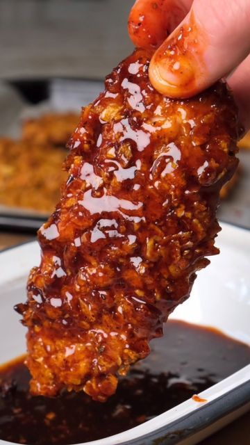 The Good Bite on Instagram: "BBQ Cajun Chicken Tenders 😍 SAVE this one for later and TAG a friend 🙏 Crispy chicken tossed in a BBQ glaze - a healthy alternative to fried chicken & very quick to make 🤌 500g of chicken tenders. Cajun seasoning. Cayenne pepper. Smoked paprika.  1/4 tsp of salt. Black pepper, to taste. 2 eggs. 150g of cornflakes. 2 tbsp BBQ sauce. 2 tbsp of Honey. A squeeze of lemon. 1 plump clove of garlic - finely chopped. Full recipe is on our website. Link in bio. #TheG Tossed Chicken Tenders, Bbq Cajun Chicken Tenders, Bbq Tenders, Glazed Chicken Tenders, Glazed Fried Chicken, Honey Bbq Chicken Tenders, Crispy Cajun Chicken, Cajun Chicken Tenders, Bbq Chicken Strips