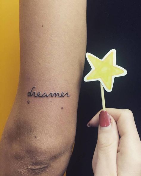 “Dreamer” tattoo on the back of the left arm. Dreamer Tattoo, Tattoo Back Of Arm, One Word Tattoo, One Word Tattoos, Back Of Arm Tattoo, Phrase Tattoos, Small Shoulder Tattoos, Tattoo Back, Small Tattoos With Meaning