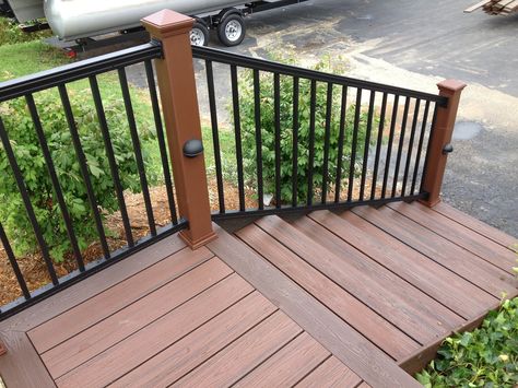 Black Aluminum Railing with Trex Posts, and pathway lighting Vinyl Deck Railing, Aluminum Railing Deck, Deck Skirting, Vinyl Deck, Deck Railing Design, Deck Colors, Aluminum Decking, Deck Designs Backyard, Staining Deck