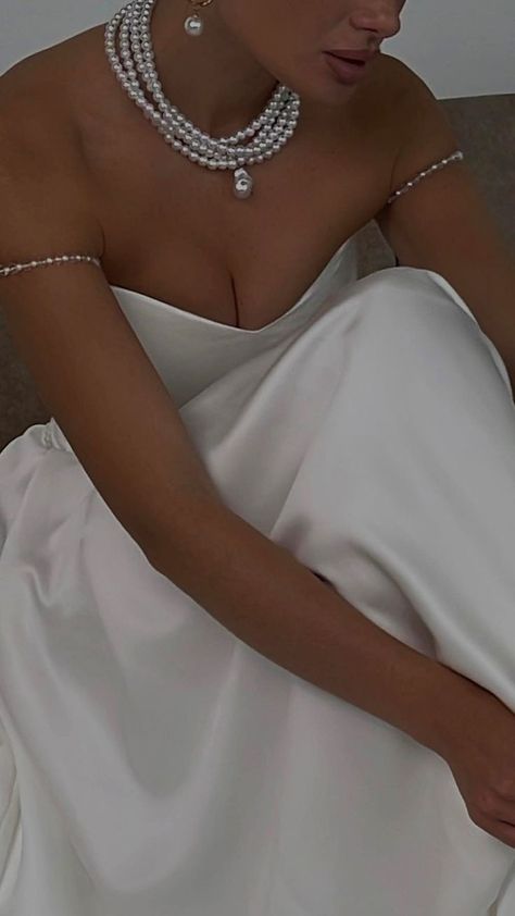 Style: 30582 Closure: Lace-Up Details: Pearls Fabric: Stain Neckline: V-Neck Silhouette: A-Line Dress With Pearl Necklace, Simple Wedding Dress Casual, Simple Bridal Gowns, Wedding Dress Simple, White Satin Dress, White Hall, Wedding Gown Styles, Classy Wedding Dress, V Dress