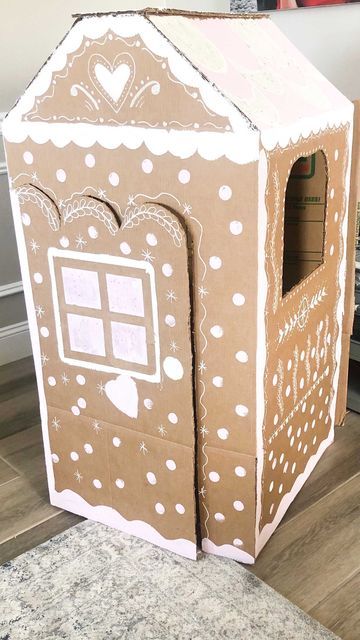 Elena ✨ School Psychologist on Instagram: "DIY Gingerbread Playhouse! Encouraging pretend play doesn’t mean having to spend a lot of money!! Here is some inspiration to make your own playhouse made from a cardboard box. I’m excited to see what you come up with! 😍 Reasons why I am an advocate for pretend play: - It helps children learn about themselves and others - They engage in social roles that are important to their world - It helps develop their social/emotional skills by providing a conte Gingerbread Pretend Play, Cardboard Gingerbread Playhouse, Cardboard House Ideas, Cardboard Box Playhouse Diy, Gingerbread Porch, Gingerbread Playhouse, Cardboard Gingerbread, Playhouse Diy, Cardboard Box Houses