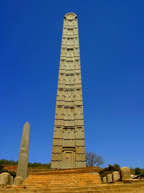 The Obelisk of Axum is a 1,700-year-old, 24-metres  tall granite obelisk, weighing 160 tonnes, in the city of Axum in Ethiopia, erected during the 4th century A.D. by subjects of the Kingdom. In 1937, it was taken as war booty and moved to Rome by the Italians.  Numerous attempts to return the stele, remained unsuccessful until an American-Ethiopian, Dr. Aberra Molla, threatened the Italian government with the option of raising the money on the Internet. Axum Obelisk, Oromo People, Elvis Costello, 1st Century, Ancient City, Iron Age, African History, Ancient Architecture, Ancient Civilizations