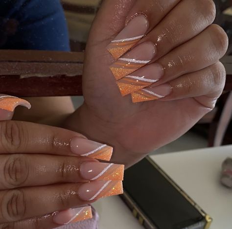 Orange Nails Homecoming, Cute Orange And White Nails, Orange And White Acrylic Nails Designs, Orange Gold Nails Design, Blue N Orange Nails, Orange Neutral Nails, Nails Acrylic Fire Flames, Orange And White Fall Nails, Orange White And Gold Nails