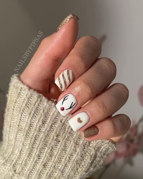 17 Festive Christmas Nail Designs for 2023 - thepinkgoose.com Reigndeer Nails, Christmas Nails Acrylic Reindeer, Reindeer Acrylic Nails, Rain Deer Nails, Reindeer Nails Designs, Rudolf Nails, Christmas Nails Reindeer, Christmas Reindeer Nails, Reindeer Christmas Nails