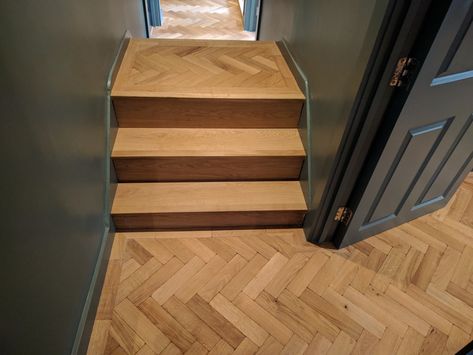 These awkward steps could have been a complete eyesore, but thanks to a clever bit of planning they have become a beautiful feature.  We clad the steps in engineered oak boards and then fitted the aged parquet on top, to match the rest of the flooring. Parquet Flooring Stairs, Real Wood Flooring, Floor Patterns Wood, Hardwood Floor Ideas, Wood Flooring Design, Wood Floor Stairs, Flooring Design Ideas, Stairs Cladding, Oak Parquet Flooring