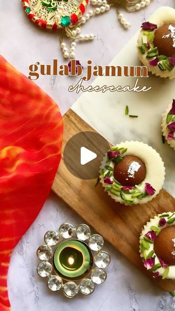 Namisha Bhandari | thenoshytales on Instagram: "An ultimate Indian fusion dessert is here to light up your special occasion! Aren’t you excited by the very idea of pairing sweet Gulab Jamuns with cheesecake? This combination is an explosion of flavour and texture in every bite. All you need is 100 gm crushed digestive biscuits 50 gm melted butter 170 gm cream cheese 60 gm whipping cream 150 gm condensed milk 1 tsp vanilla extract 1 tsp Cardamom powder 10 gm cornflour 6 pc gulab jamun dried rose petal, pistachio, silver leaf for garnishing . . . . #cheesecake #gulabjamuncheesecake #fusiondessert #cheesecakerecipe #diwalihampers #diwalidesserts #diwaligifts #diwalidecorations #diwalivibes✨ #diwalivibes #desserttable #desserts #cheesecakelovers #bakedcheesecake #cheesecakecups # Gulab Jamun Cheesecake, Cake Shots, Cheesecake Lovers, Cheesecake Cups, Gulab Jamun, Digestive Biscuits, Cardamom Powder, Cheesecake Bites, Dried Rose Petals