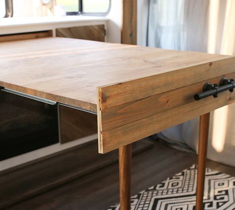 We’re obsessed with this space-saving DIY expandable table that's hidden when not in use, but transforms into a desk or table in under a minute! #rvrenovation #rvreno #expandingtable #diydesk #transformingtable #tabledesign #modularfurniture #rvinspiration #campermakeover #hiddentable #drawertable #tinyhomeideas Murphy Style Dining Table, Slide Out Table Camper, Slide Out Dining Table, Diy Pull Out Table, Dropleaf Tables Diy, Hidden Folding Table, Diy Expandable Table, Tiny House Table Ideas, Murphy Table Diy Small Spaces