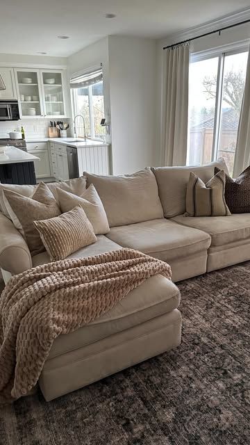 Brittany | Home Inspo | Decor Finds | Organization on Instagram: "This couch is over 13 years old! It’s survived three moves and two kids. It has definitely seen better days and the style feels dated to me, but updating the throw pillows made a huge difference!

I recommend choosing quality down inserts and swapping out your pillow covers as the season or your style changes.

Comment “pillows” for a link!

Living room inspo
Neutral home decor
Couch styling 
Sofa styling
Colin and Finn 
Organic modern

#homedecor #organicmodern #neutralhome #interiordesign #livingroomdecor #throwpillows #colinandfinn" Light Tan Leather Couch Living Room, Living Room Decor Tan Couch, Oatmeal Couch Living Rooms, Light Brown Couch Living Room Ideas, Cozy Couches Living Room, Room Inspo Neutral, Tan Leather Couch Living Room, Khaki Sofa, Light Brown Couch